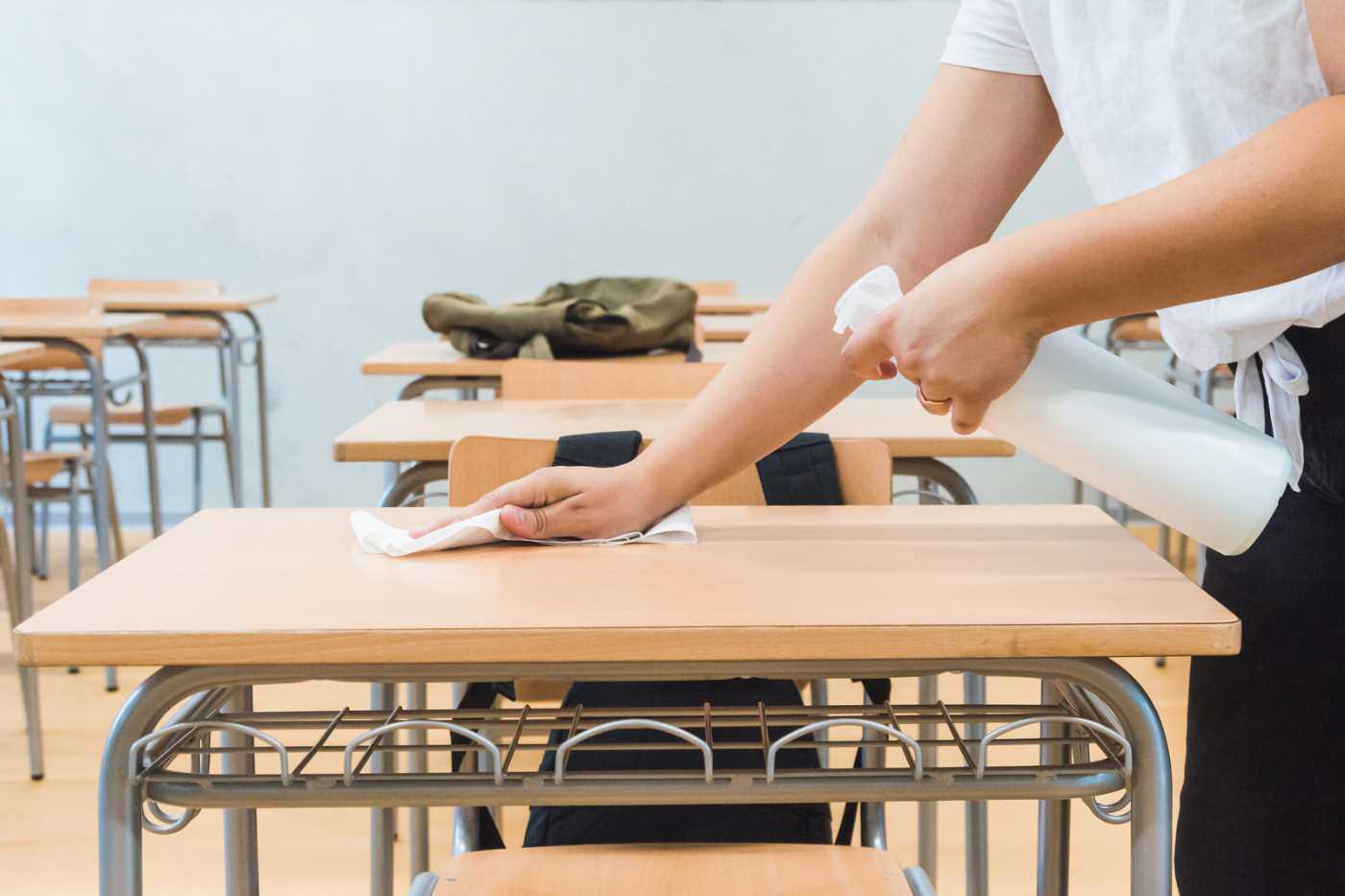 Team Member Cleaning A Desk