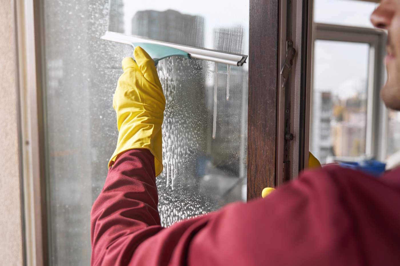 Man Cleaning Office Window