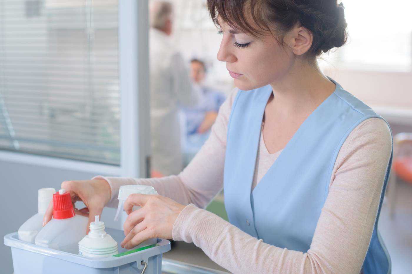 Woman Cleaning In Hospital Setting