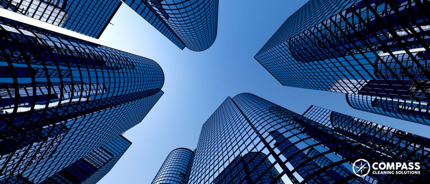 Looking up at a large office buildings